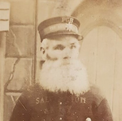 Close up from another Victorian photo of an old man with a large white beard.